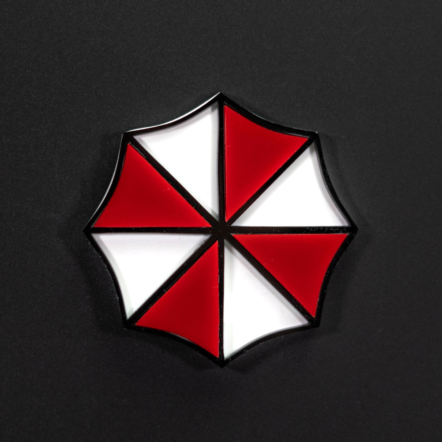 Von Umbrella Corp inspiriertes Icon-Abzeichen