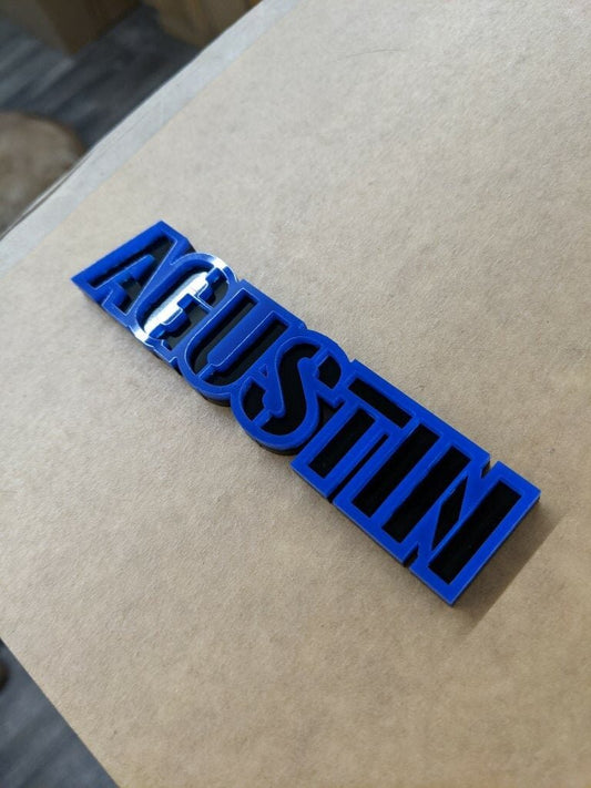 Agustin Car Badge - Blue On Gloss Black - Stencil Font - Tape Mount - Atomic Car Concepts