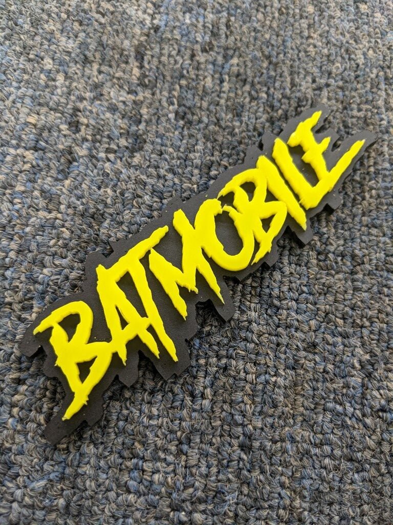 Batmobile Car Badge - Yellow On Matte Black - Aggressive Font - Atomic Car Concepts