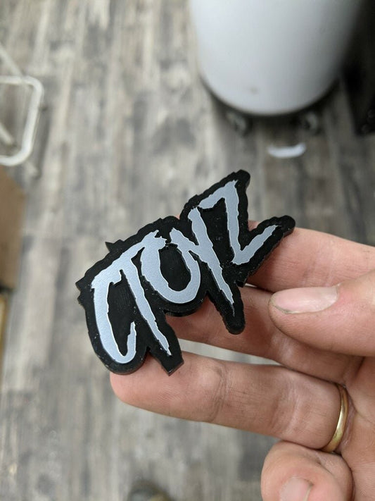 CToys Car Badge - Brushed Silver On Gloss Black - Aggressive Font