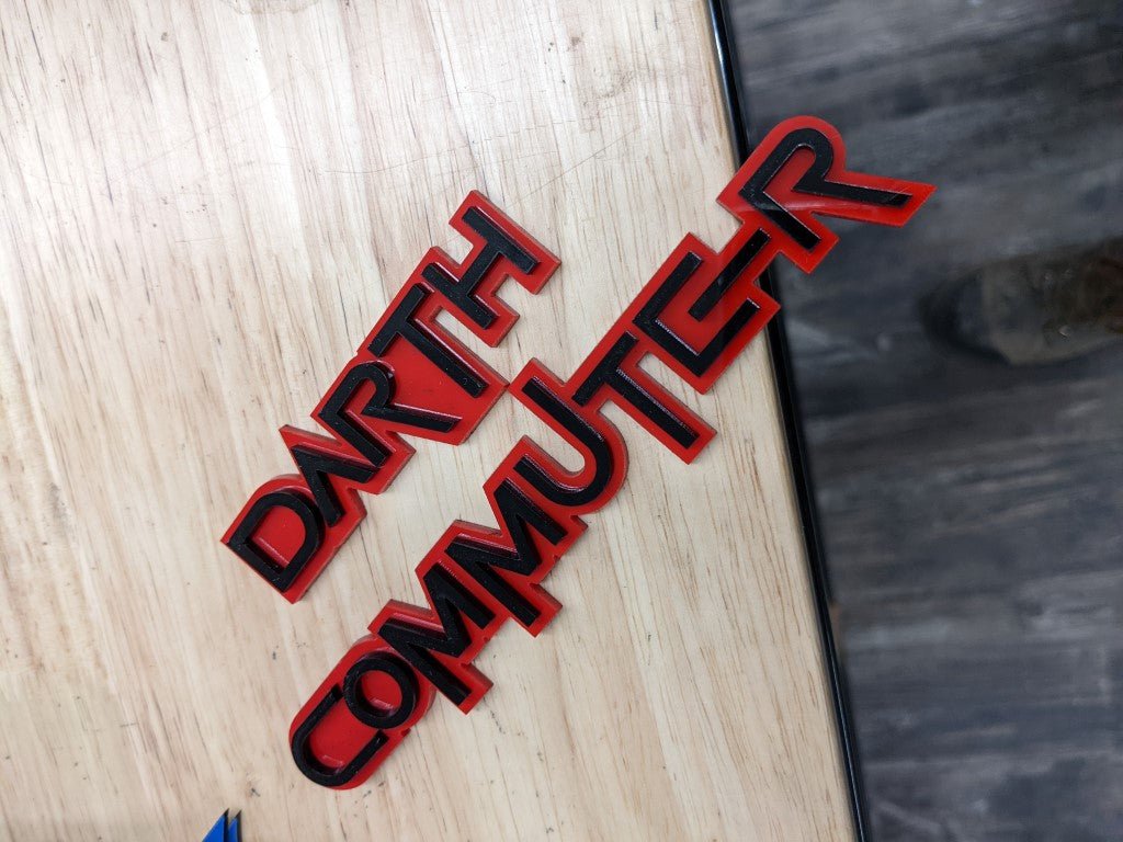 Darth Commuter Car Badge - Gloss Black On Red - Squid Font - Tape Mount - Atomic Car Concepts