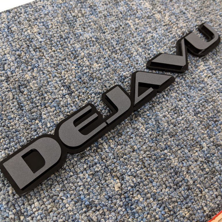 Deja Vu Car Badge - Matte Black On Gloss Black - OEM Font - Atomic Car Concepts