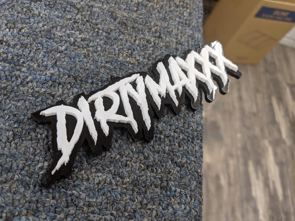 Dirty Maxxx Car Badge - White On Gloss Black - Aggressive Font - Atomic Car Concepts