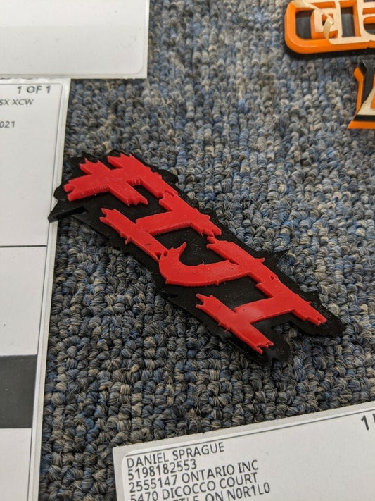 Fiji Car Badge - Red On Gloss Black - Lightning Font