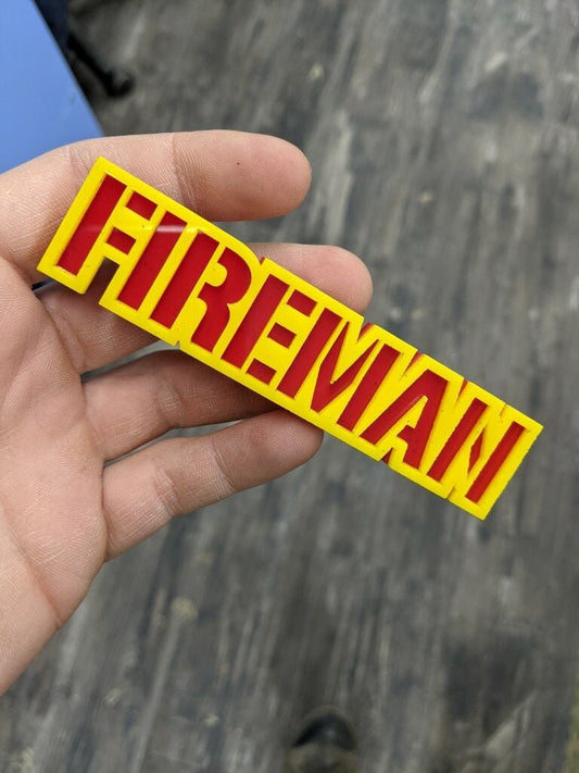 Fireman Car Badge - Yellow On Red - Stencil Font - Tape Mount