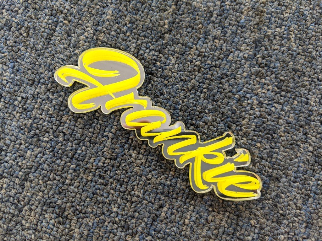 Frankie Car Badge - Yellow On Mirror Silver - Script Font - Atomic Car Concepts