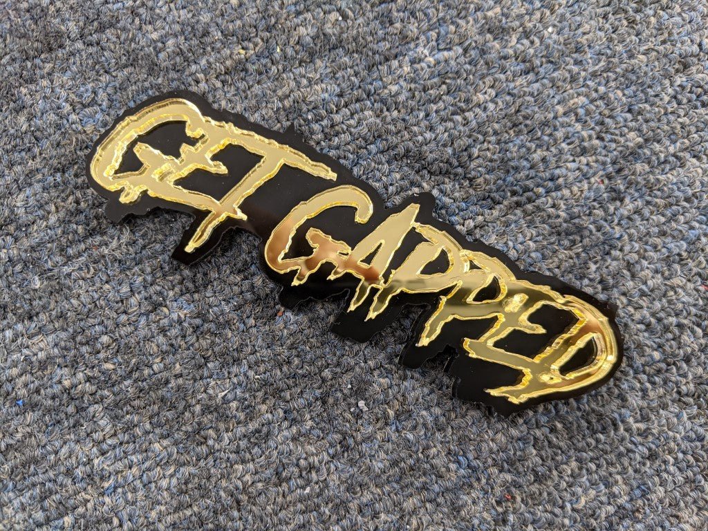 Get Gapped Car Badge - Mirror Gold On Gloss Black - Aggressive Font - Atomic Car Concepts