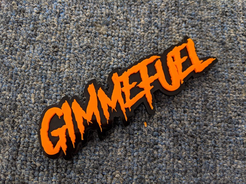 Gimmefuel Car Badge - Orange on Gloss Black - Aggressive Font - Tape Mounting - Atomic Car Concepts