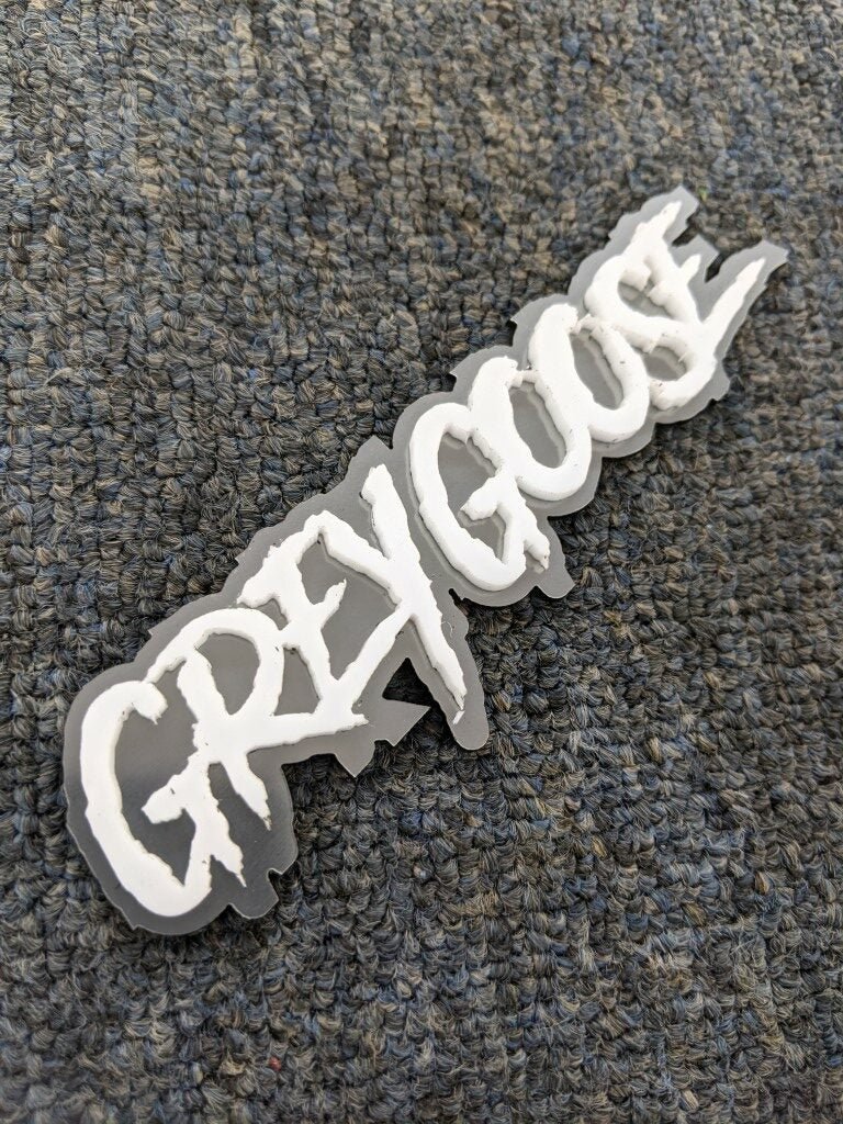 Grey Goose Car Badge - White on Brushed Silver - Aggressive Font - Tape Mounting - Atomic Car Concepts