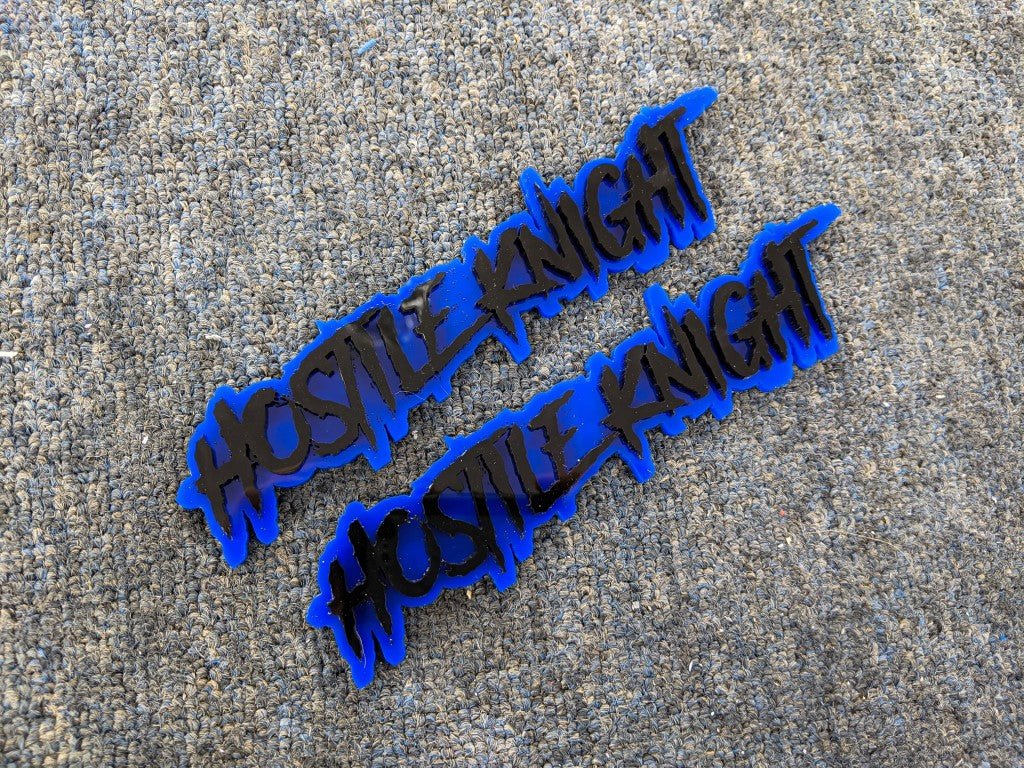 Hostile Knight Car Badge - Gloss Black on Blue - Aggressive Font - Tape Mounting - Atomic Car Concepts