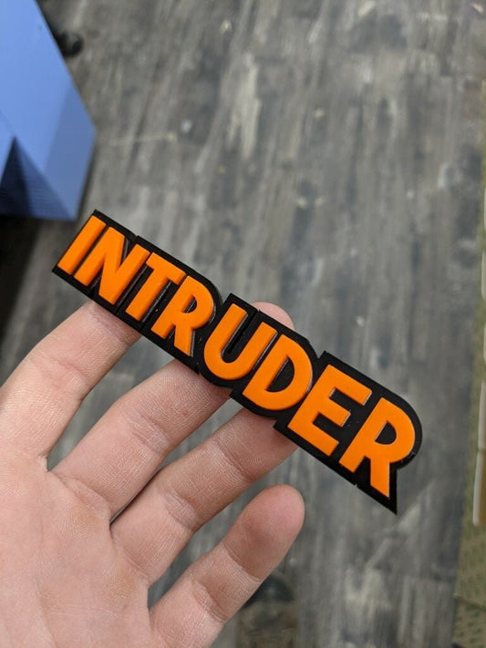 Intruder Car Badge - Orange On Gloss Black - Block Font - Atomic Car Concepts