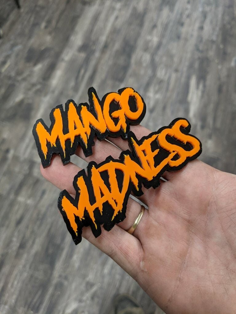 Mango Madness Car Badge - Orange On Gloss Black - Aggressive Font - Atomic Car Concepts
