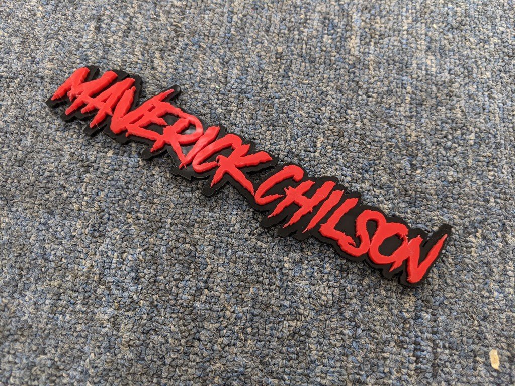 Maverick Chilson Car Badge - Red On Gloss Black - Aggressive Font - Atomic Car Concepts