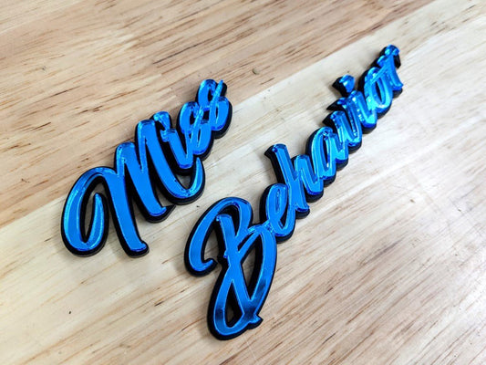 Miss Behavior Car Badge - Mirror Blue on Gloss Black - Script Font - Tape Mounting - Atomic Car Concepts