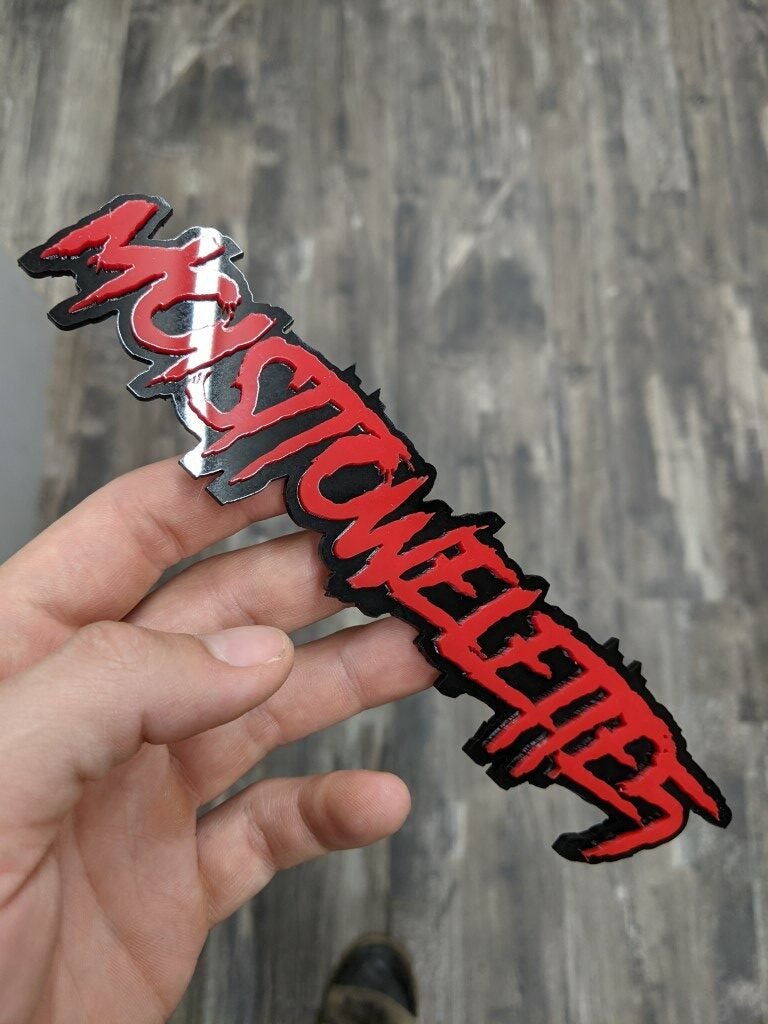 Moistowelette5 Car Badge - Red On Gloss Black - Aggressive Font - Atomic Car Concepts