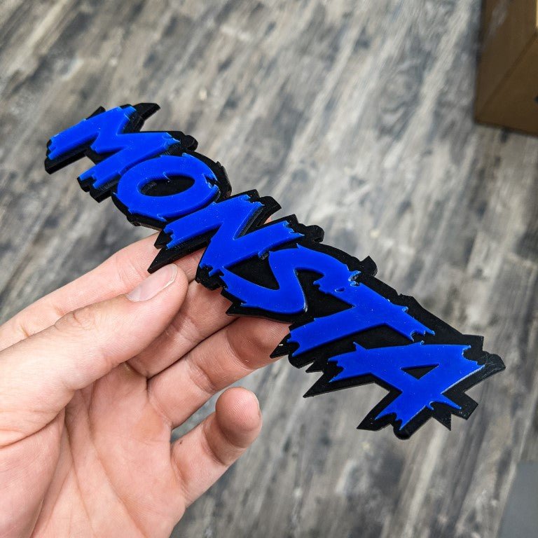 Monsta Car Badge - Blue on Gloss Black - Lightning Font - Tape Mounting - Atomic Car Concepts
