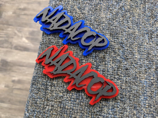 Nadacop Car Badge - Matte Black On Blue / Red - Aggressive Font - Atomic Car Concepts