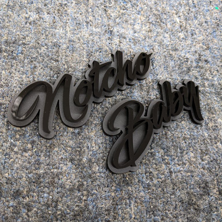 Notcho Baby Car Badge - Gloss Black On Matte Black - Script Font - Atomic Car Concepts