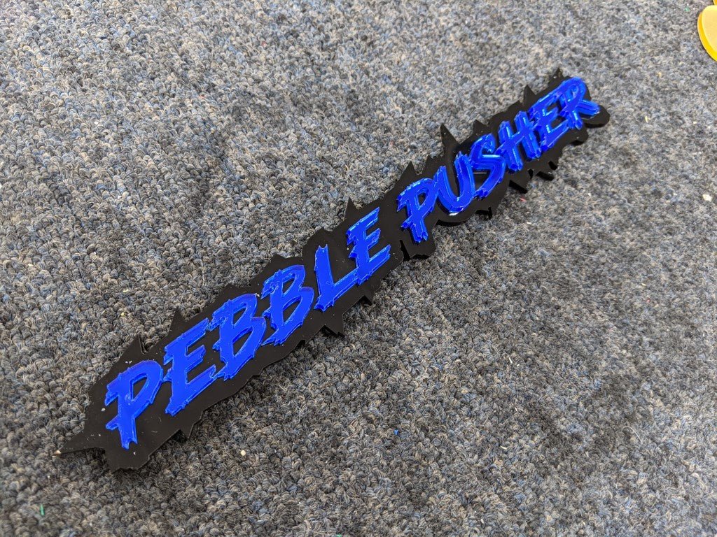 Pebble Pusher Car Badge - Mirror Blue on Gloss Black - Lightning Font - Tape Mounting - Atomic Car Concepts