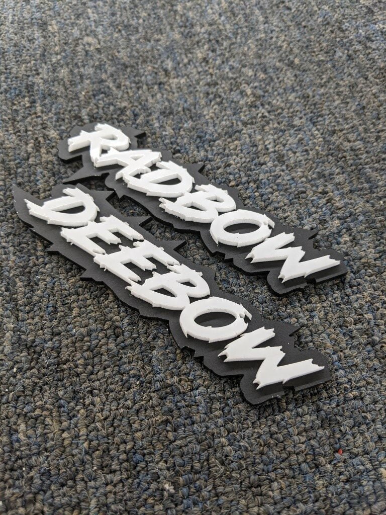 Radbow Deebow Car Badge - White on Matte Black - Lightning Font - Atomic Car Concepts