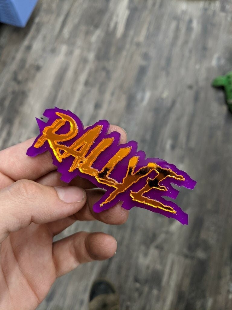 Rallye Car Badge - Mirror Orange On Purple - Aggressive Font - Atomic Car Concepts