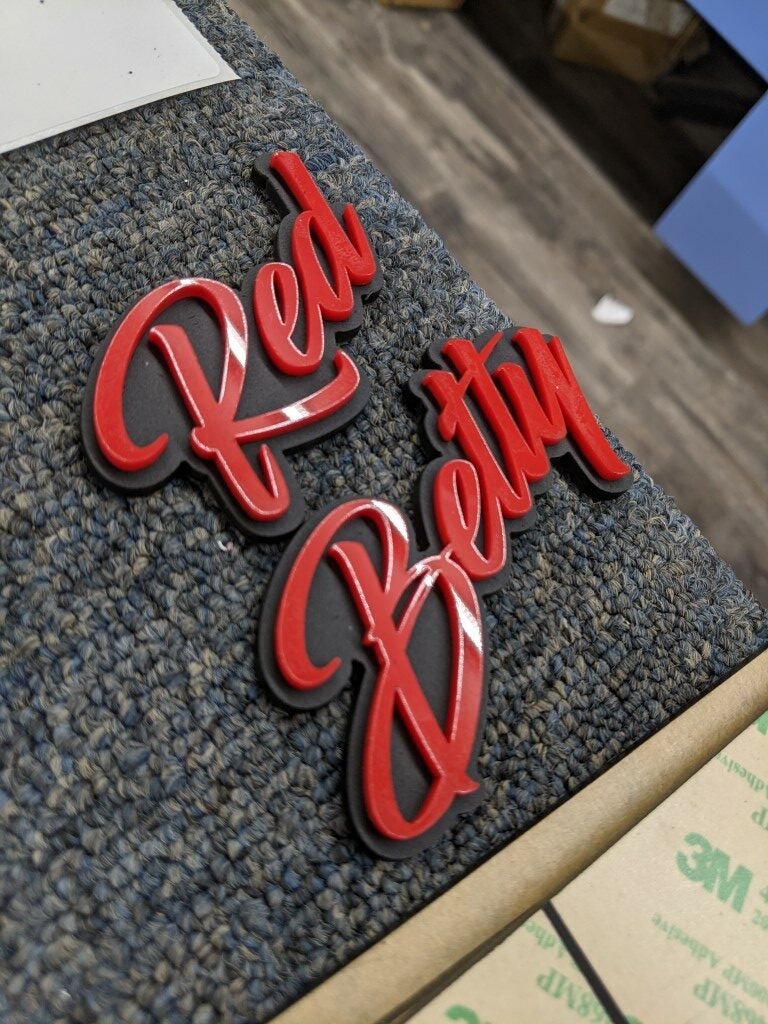 Red Betty Car Badge - Red On Matte Black - Script Font - Atomic Car Concepts