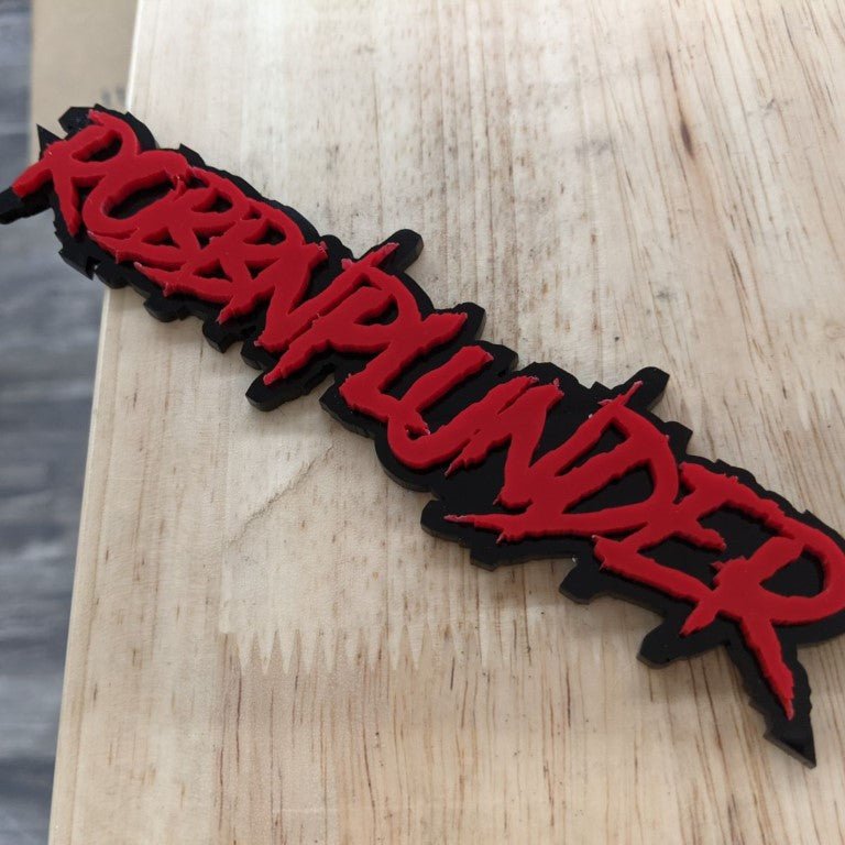 Robbnplunder Car Badge - Red on Black - Tape Mounting - Atomic Car Concepts