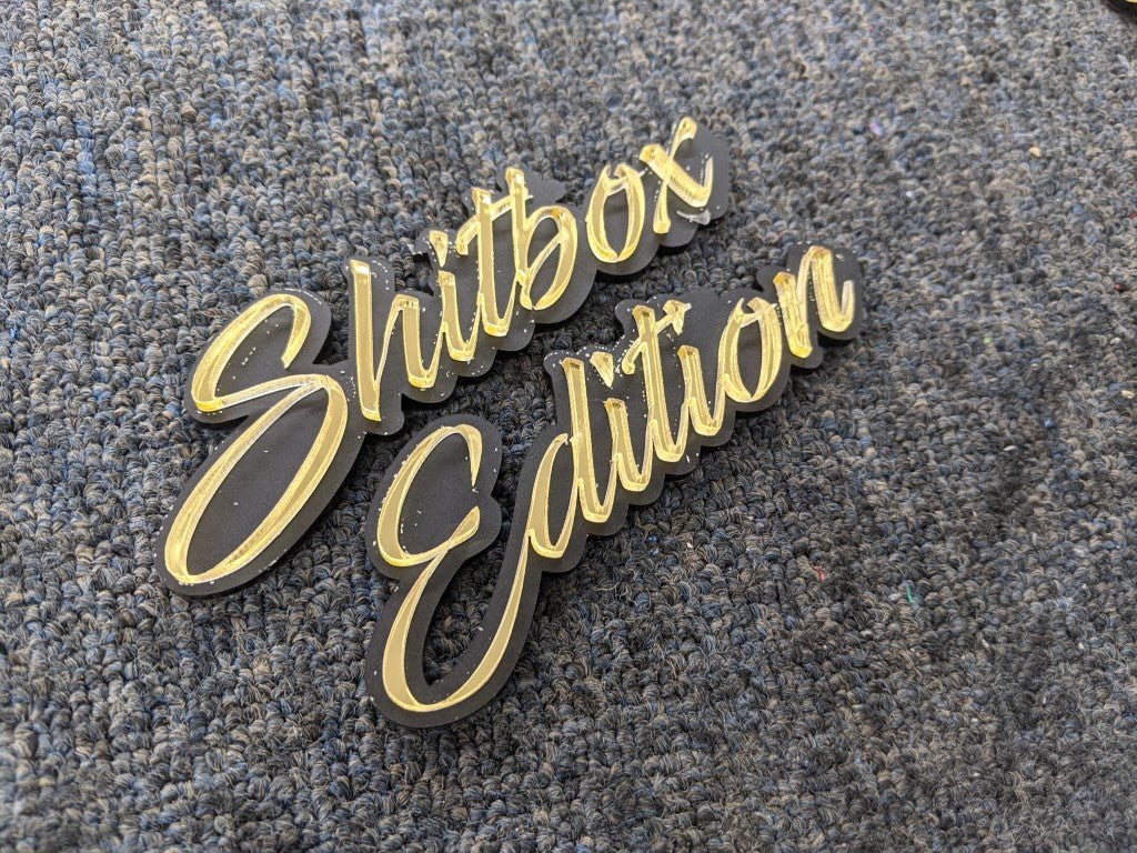 Shitbox Edition Car Badge - Mirror Gold on Matte Black - Script Font - Atomic Car Concepts