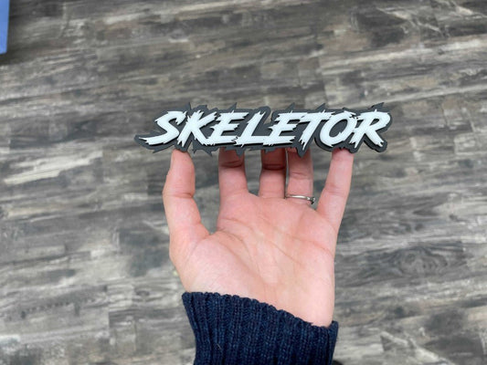 Skeletor Car Badge - White On Matte Black - Lightning Font - Atomic Car Concepts