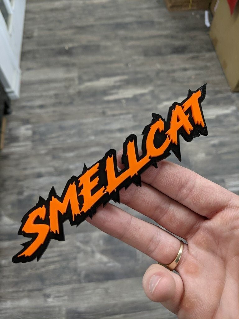 Smellcat Car Badge - Orange On Gloss Black - Lightning Font - Atomic Car Concepts