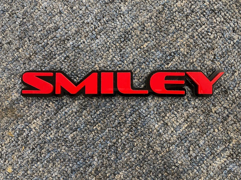 Smiley Car Badge - Red On Gloss Black - OEM Font - Atomic Car Concepts