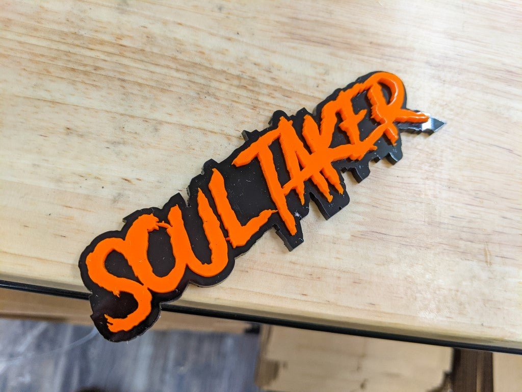 Soul Taker Car Badge - Orange on Gloss Black - Aggressive Font - Tape Mounting - Atomic Car Concepts