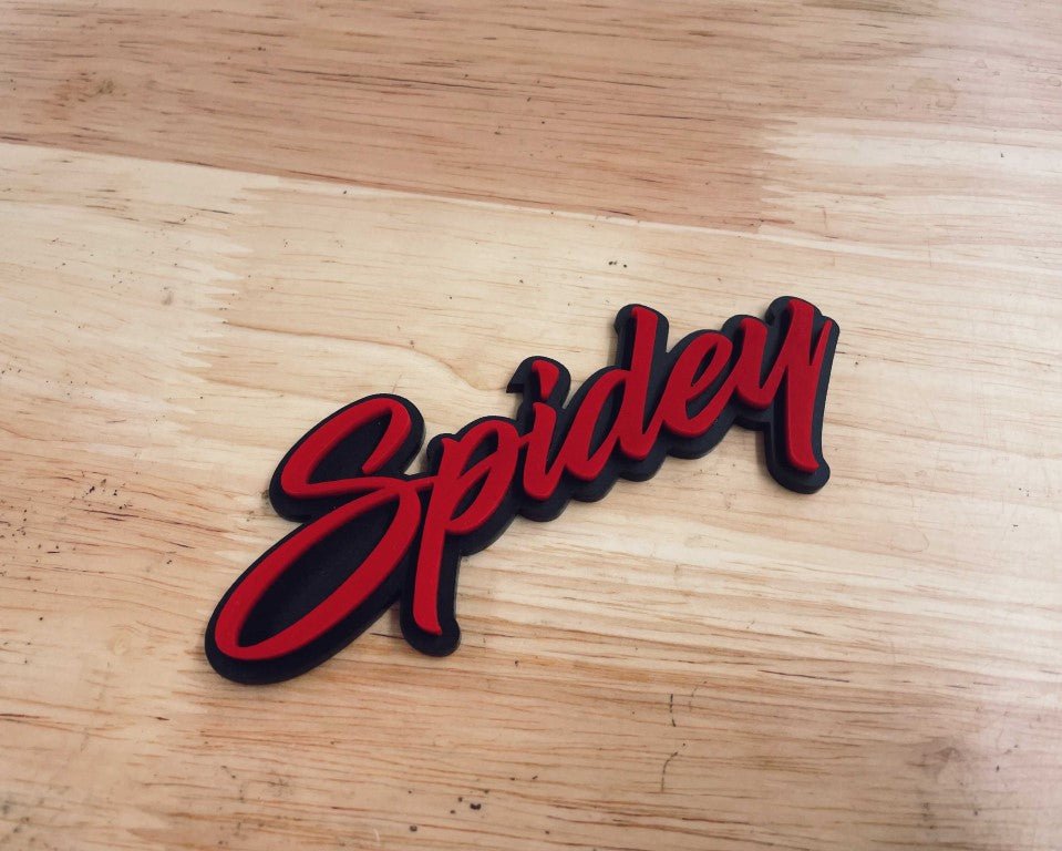 Spidey Car Badge - Red On Matte Black - Script Font - Atomic Car Concepts