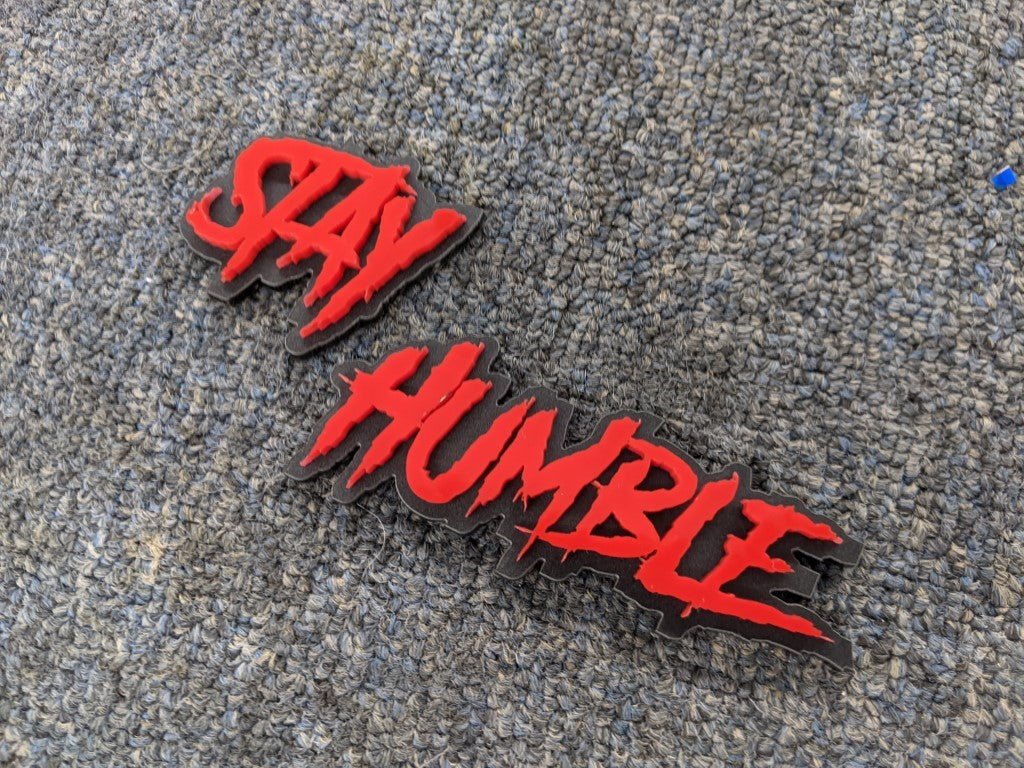 Stay Humble Car Badge - Red on Matte Black - Aggressive Font - Tape Mounting - Atomic Car Concepts