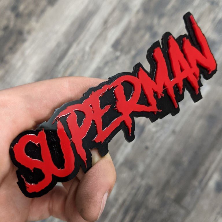 Superman Car Badge - Red on Gloss Black - Aggressive Font - Tape Mounting - Atomic Car Concepts