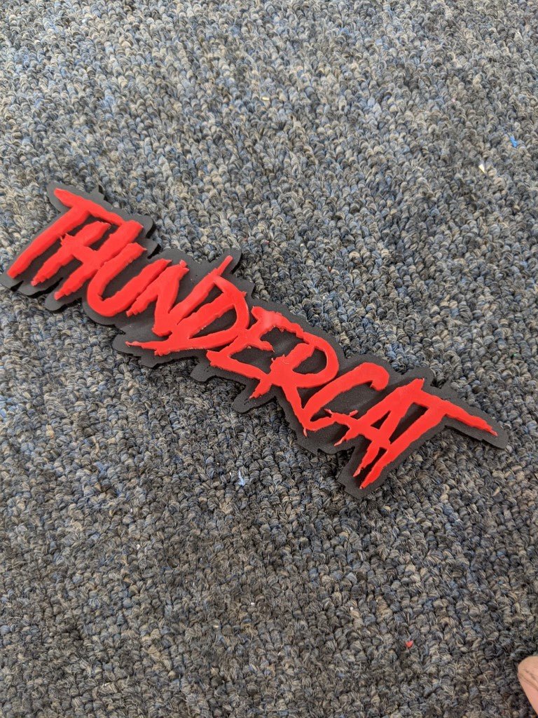 Thundercat Car Badge - Red On Matte Black - Aggressive Font - Atomic Car Concepts