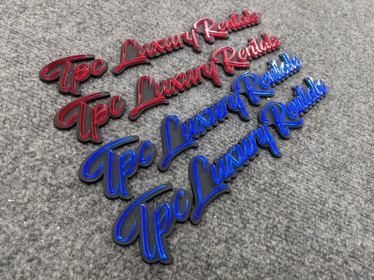 TPC Luxury Rentals Car Badge - Mirror Red and Mirror Blue on Matte Black - Script Font - Atomic Car Concepts