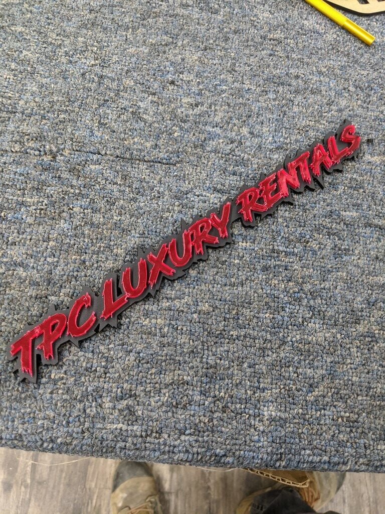 TPC Luxury Rentals Car Badge - Mirror Red On Matte Black - Lightning Red - Atomic Car Concepts