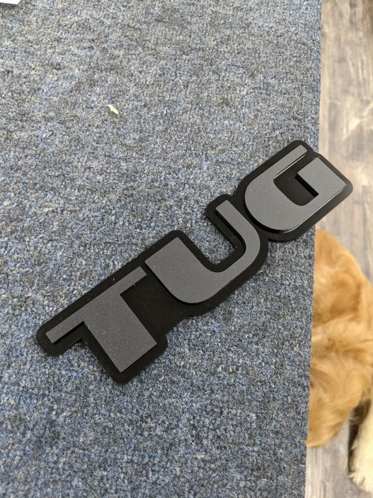 TUG Car Badge - Matte Black On Gloss Black - OEM Font - Atomic Car Concepts