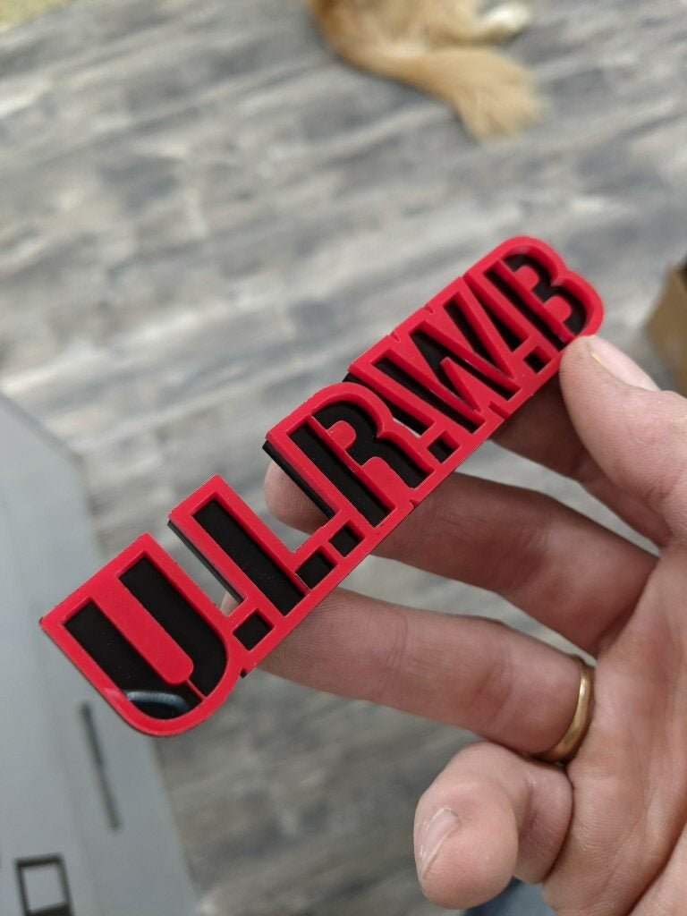 U.L.R.W.B Car Badge - Red On Gloss Black - Stencil Font - Tape Mount - Atomic Car Concepts