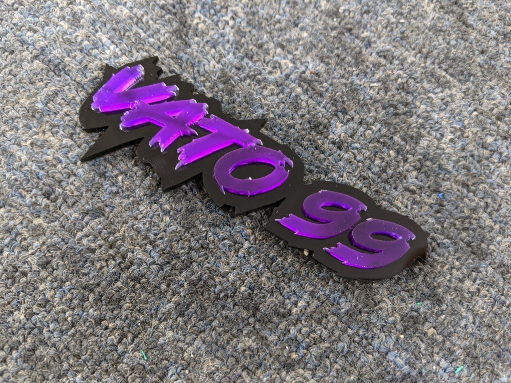 Vato 99 Car Badge - Mirror Purple on Gloss Black - Tape Mounting - Atomic Car Concepts