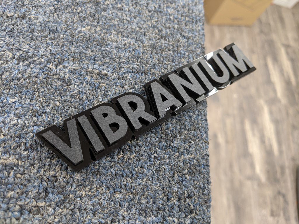 Vibranium Car Badge - Matte Black On Gloss Black - Block Font - Atomic Car Concepts