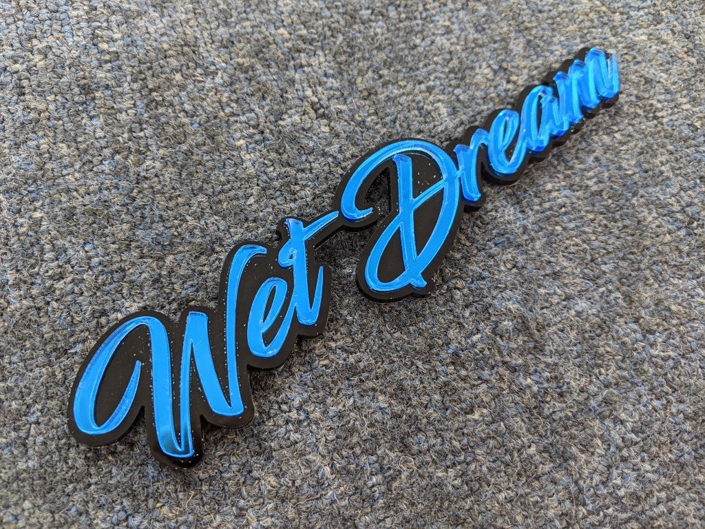 Wet Dream Car Badge - Mirror Blue on Gloss Black - Script Font - Tape Mounting - Atomic Car Concepts