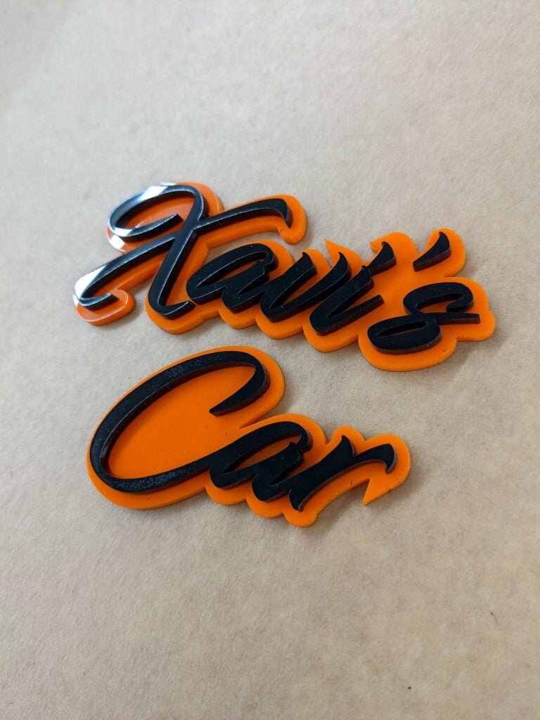 Xavi's Car Car Badge - Gloss Black On Orange - Script Font - Atomic Car Concepts